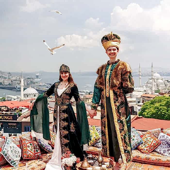 Tourist-posing-in-sultan-dress-on-rooftop.jpg